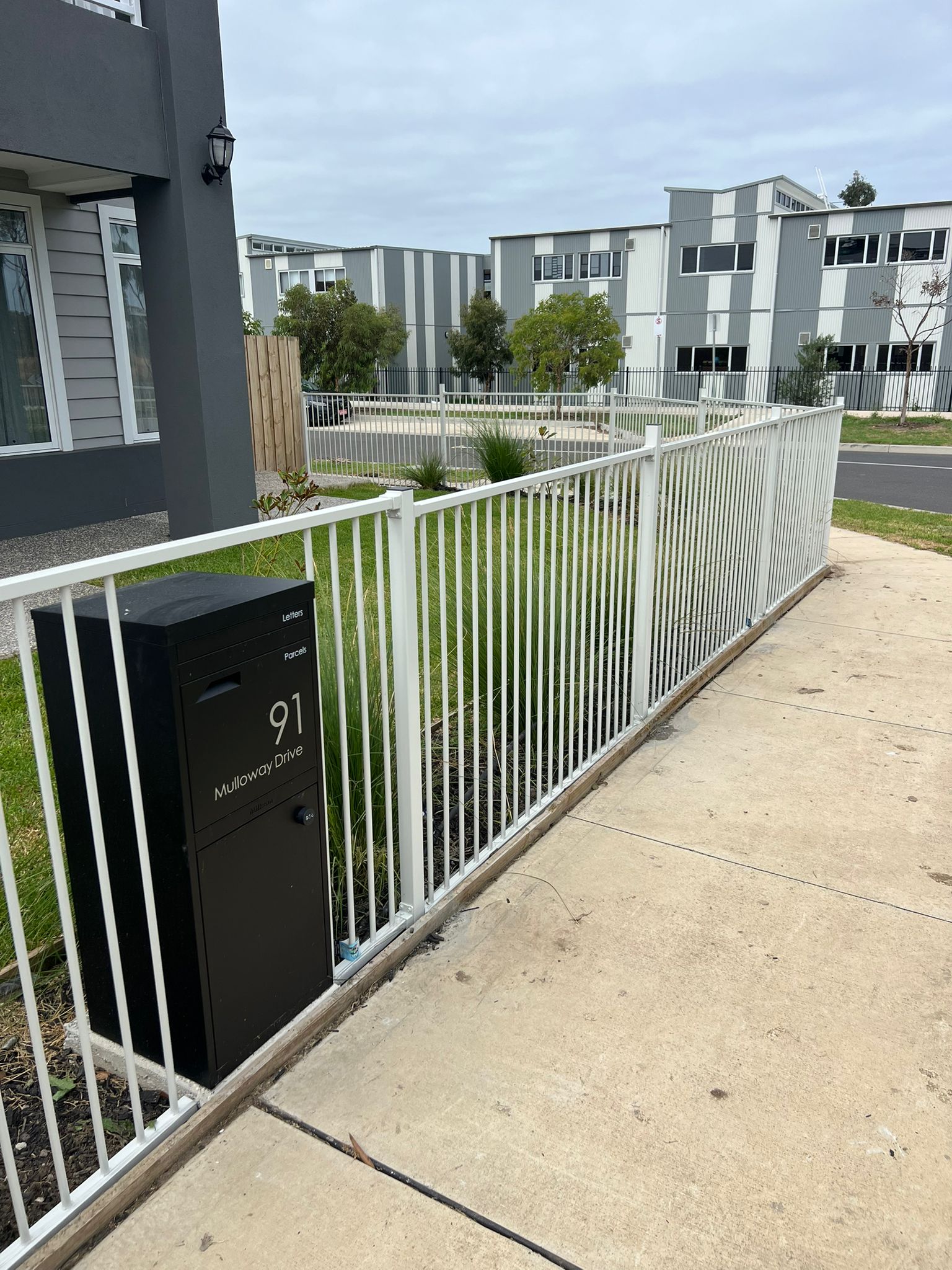White tubular aluminium pool-style boundary fence, Greenvale